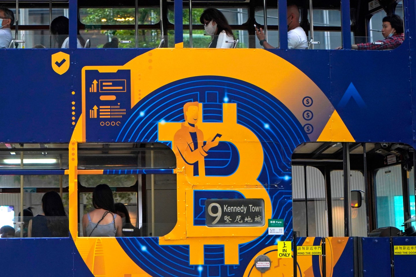 bitcoin ad displayed on a bus