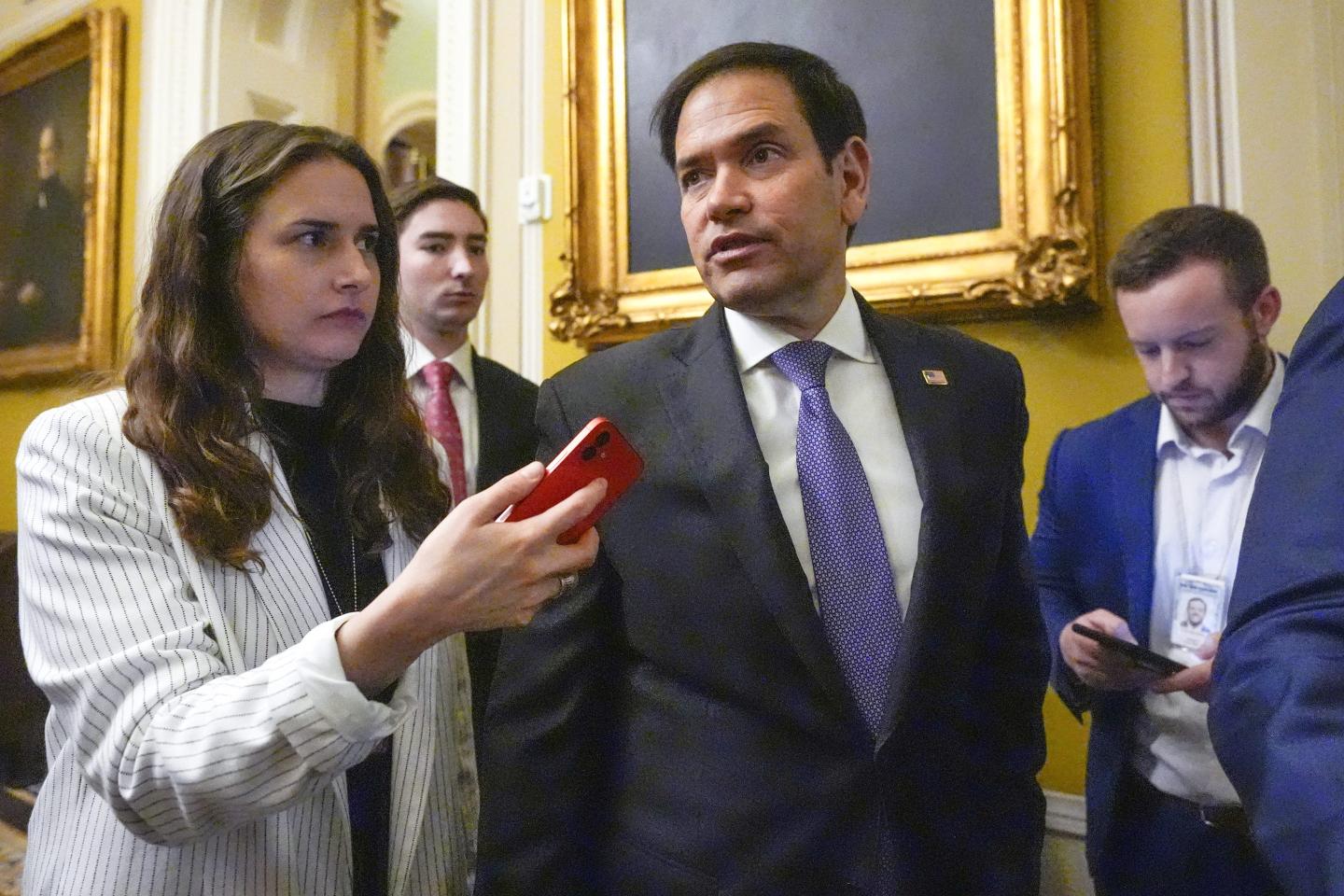 Marco Rubio speaks with reporters