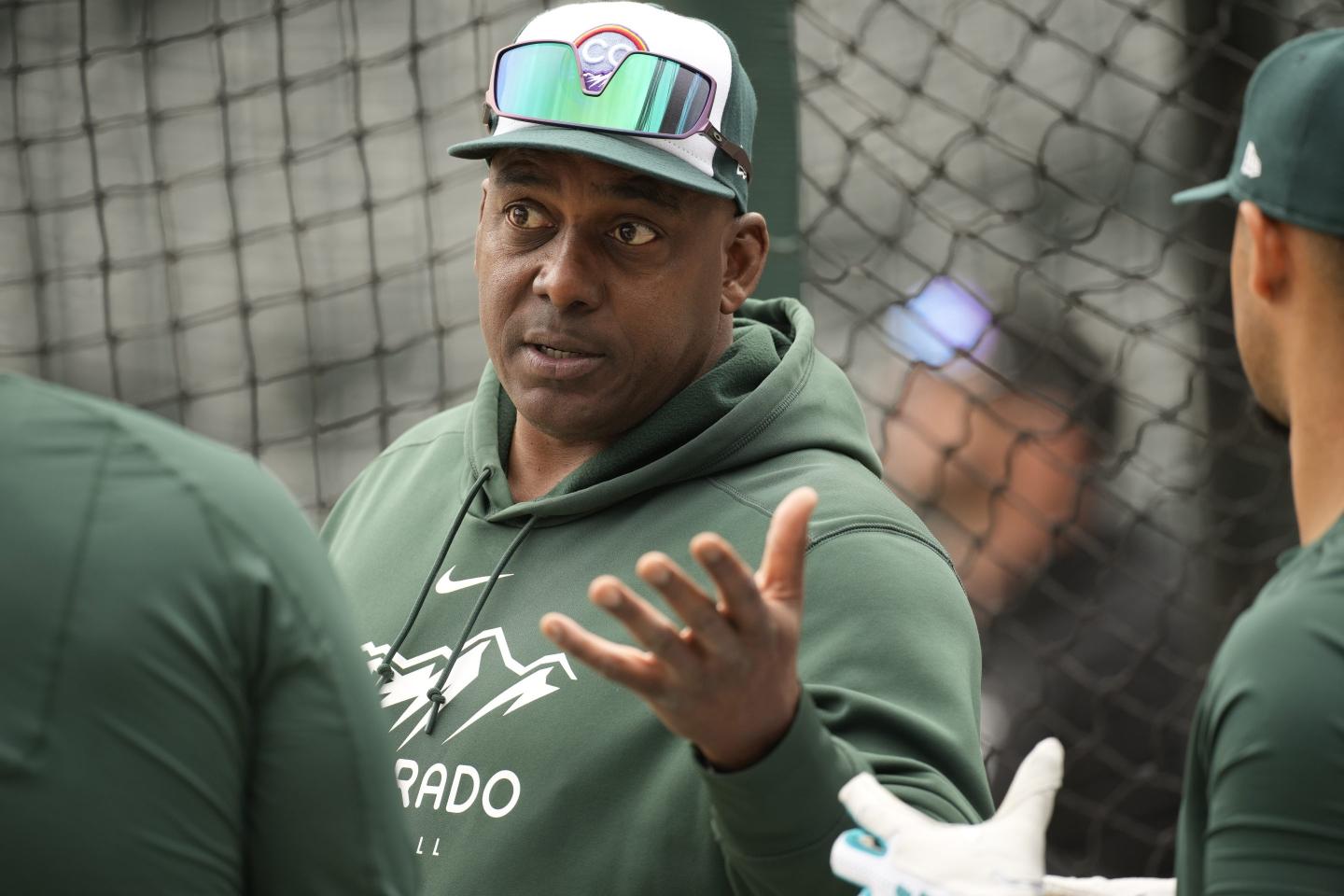 Rockies hitting coach chats with players