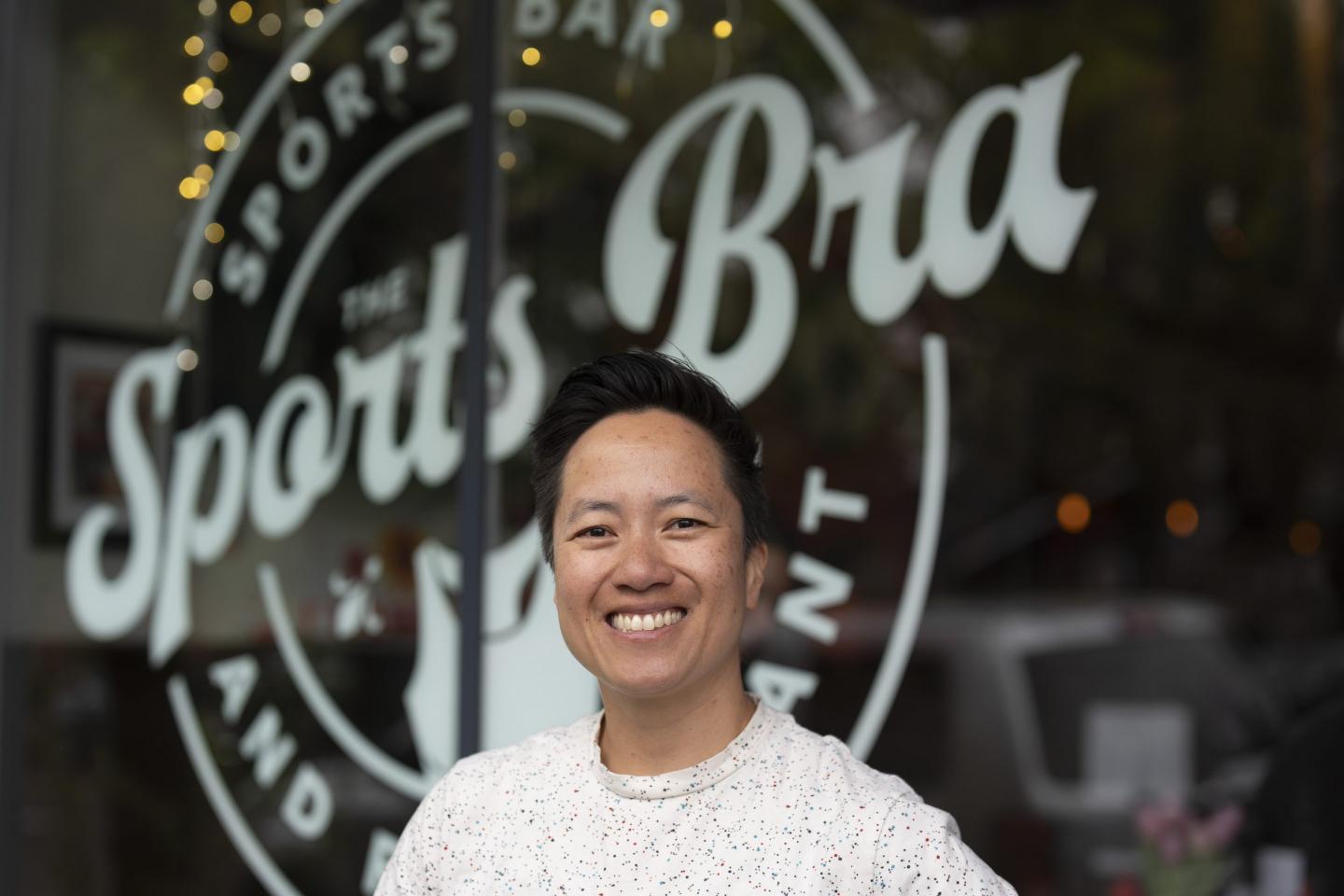 Jenny Nguyen stands in front of the Sports Bra
