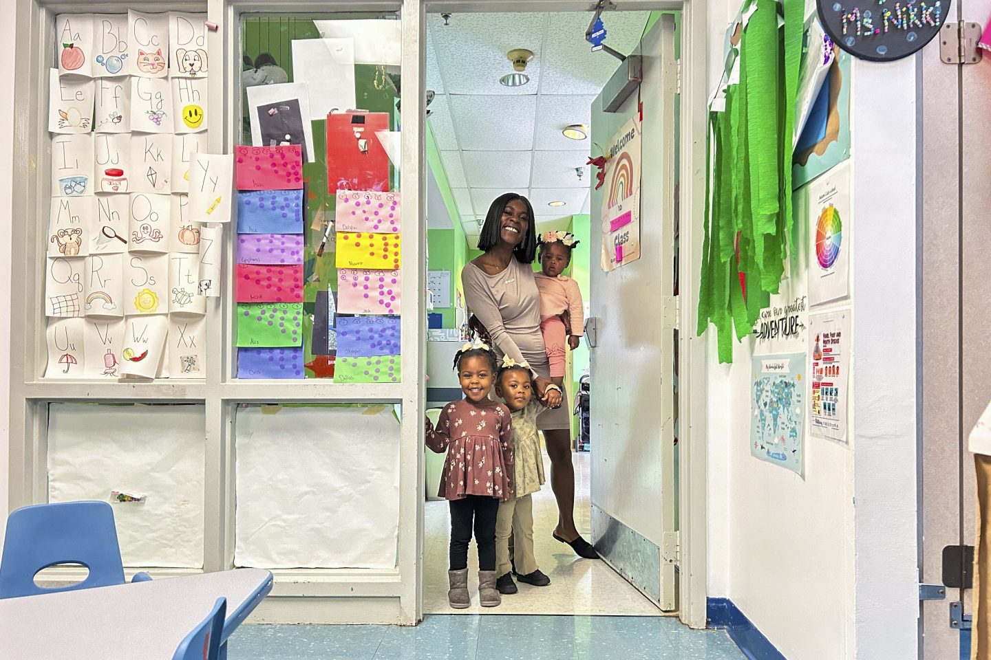 Derrika Richard as she walks her three youngest children to their child care classrooms at Clara's Little Lambs in New Orleans