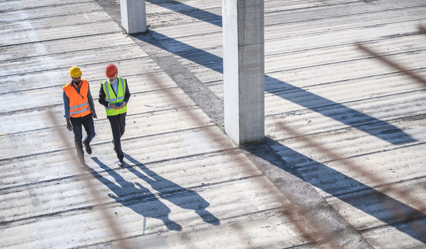 builders walking through construction site