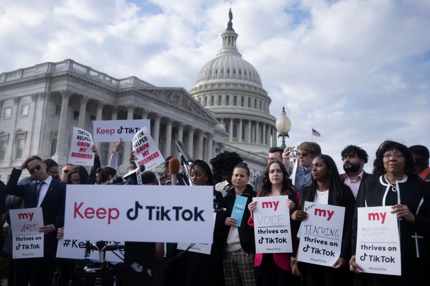 TOPSHOT &#8211; People gather for a press conference about their opposition to a TikTok ban on Capitol Hill in Washington, DC on March 22, 2023. &#8211; The White House was reported on March 15, 2023, to have told the app TikTok that it will be banned in the US if it continues to be owned by the Beijing-based tech firm Bytedance. (Photo by Brendan Smialowski / AFP) (Photo by BRENDAN SMIALOWSKI/AFP via Getty Images)