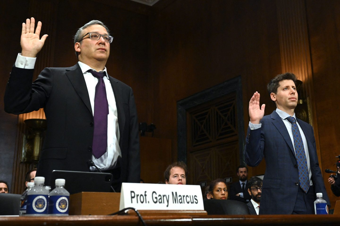 Gary Marcus and OpenAI CEO Sam Altman taking an oath during a senate hearing
