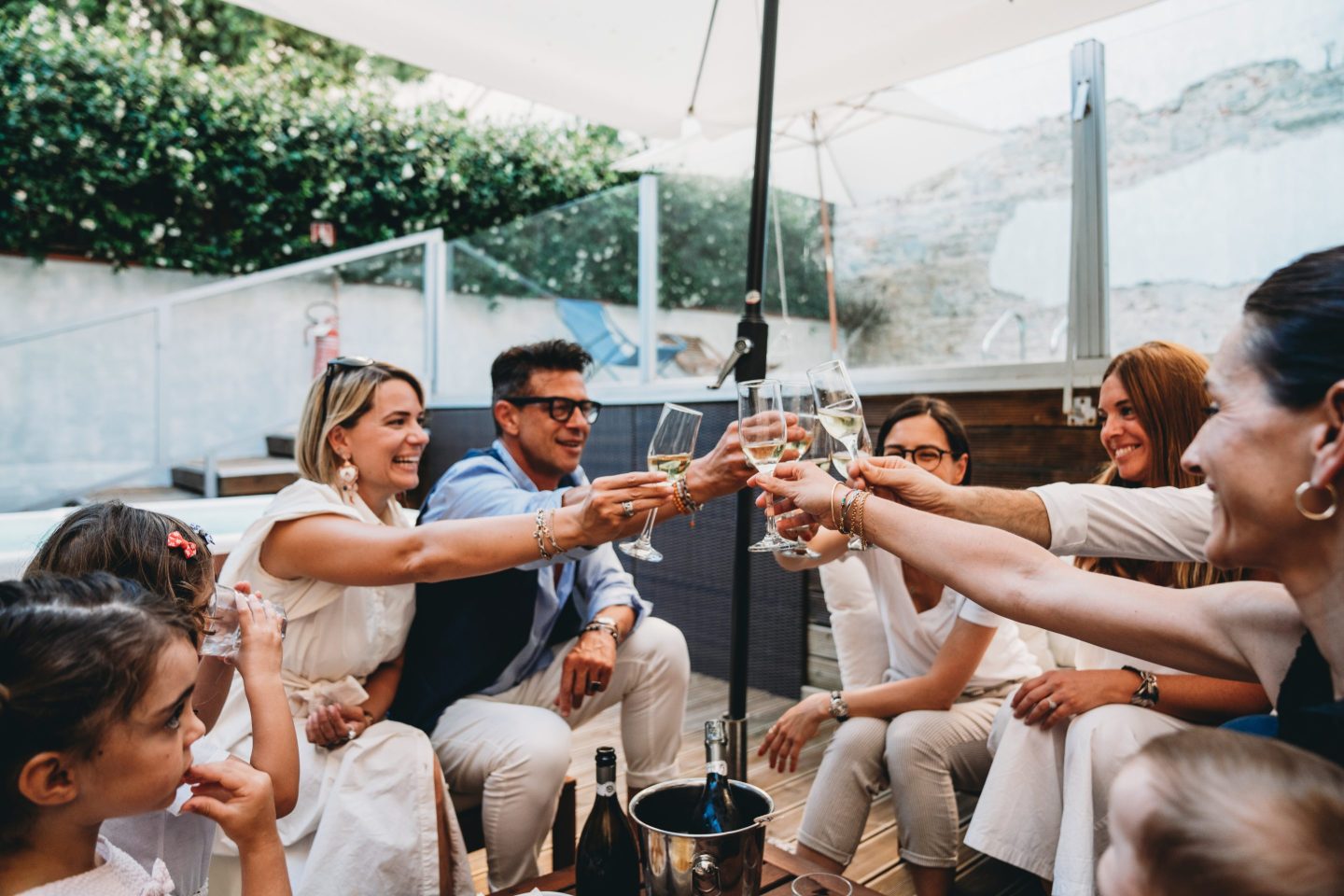 Young people toasting one another with Champagne