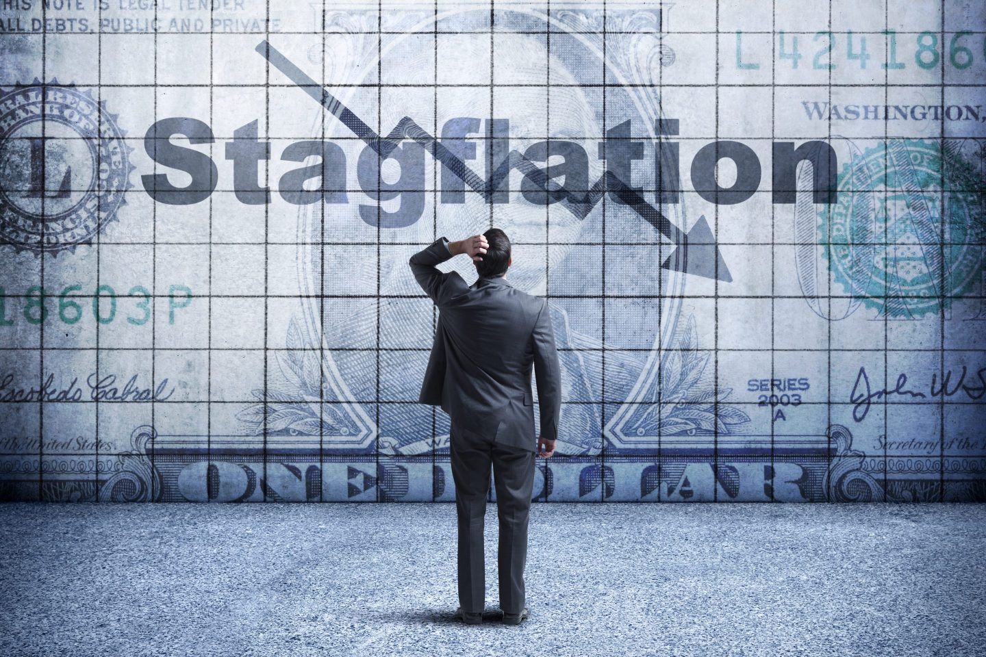 Businessman looks at chart that says stagflation