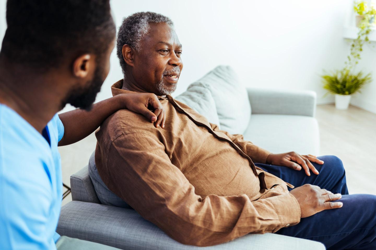 Social worker visiting with a senior man
