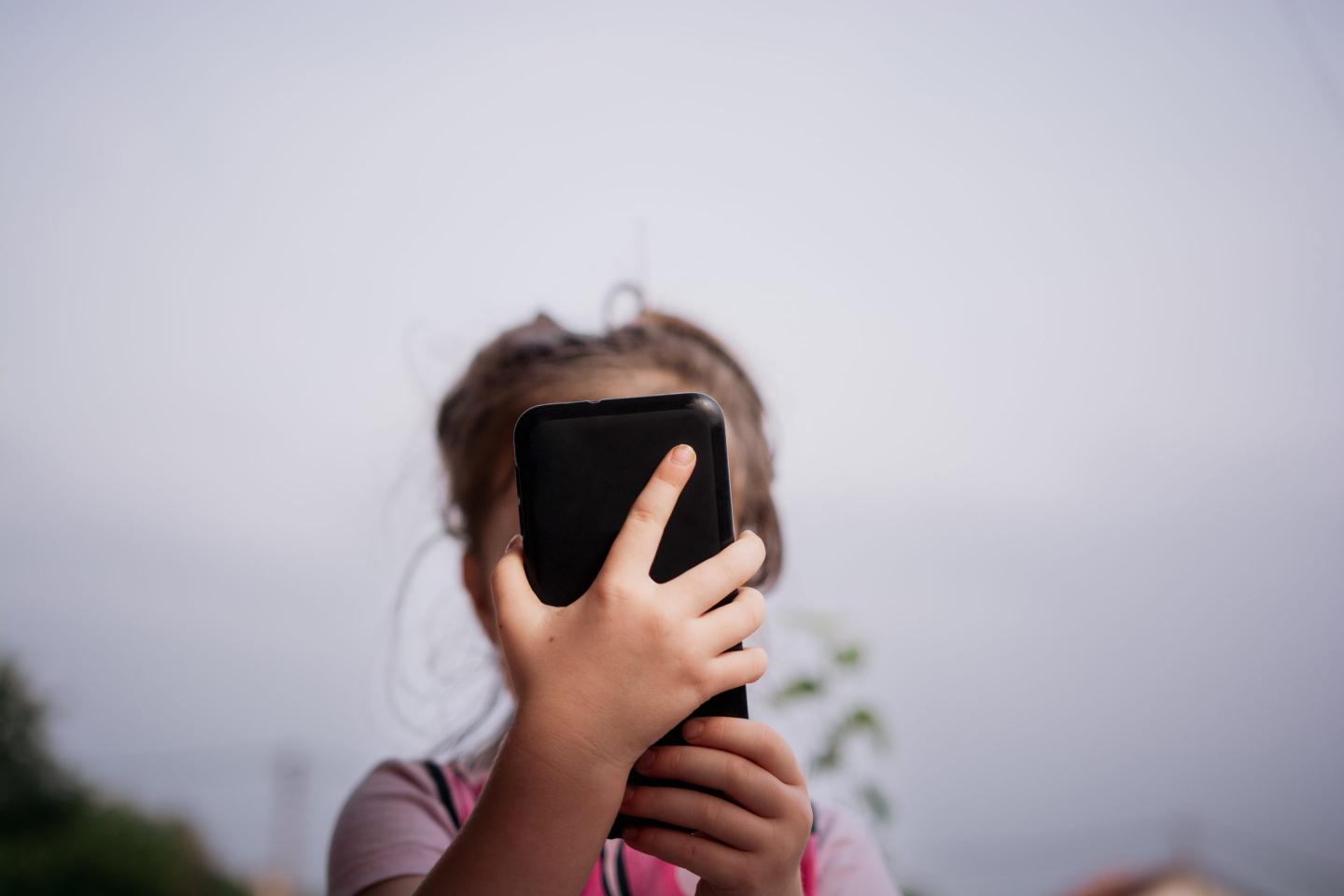 Kid on phone