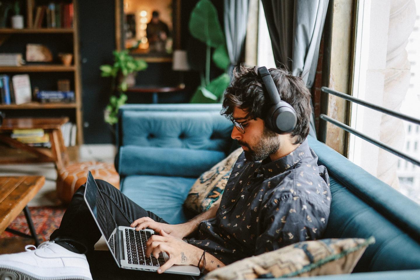 Young man working from home, doing IT work from his home in Los Angeles, California.