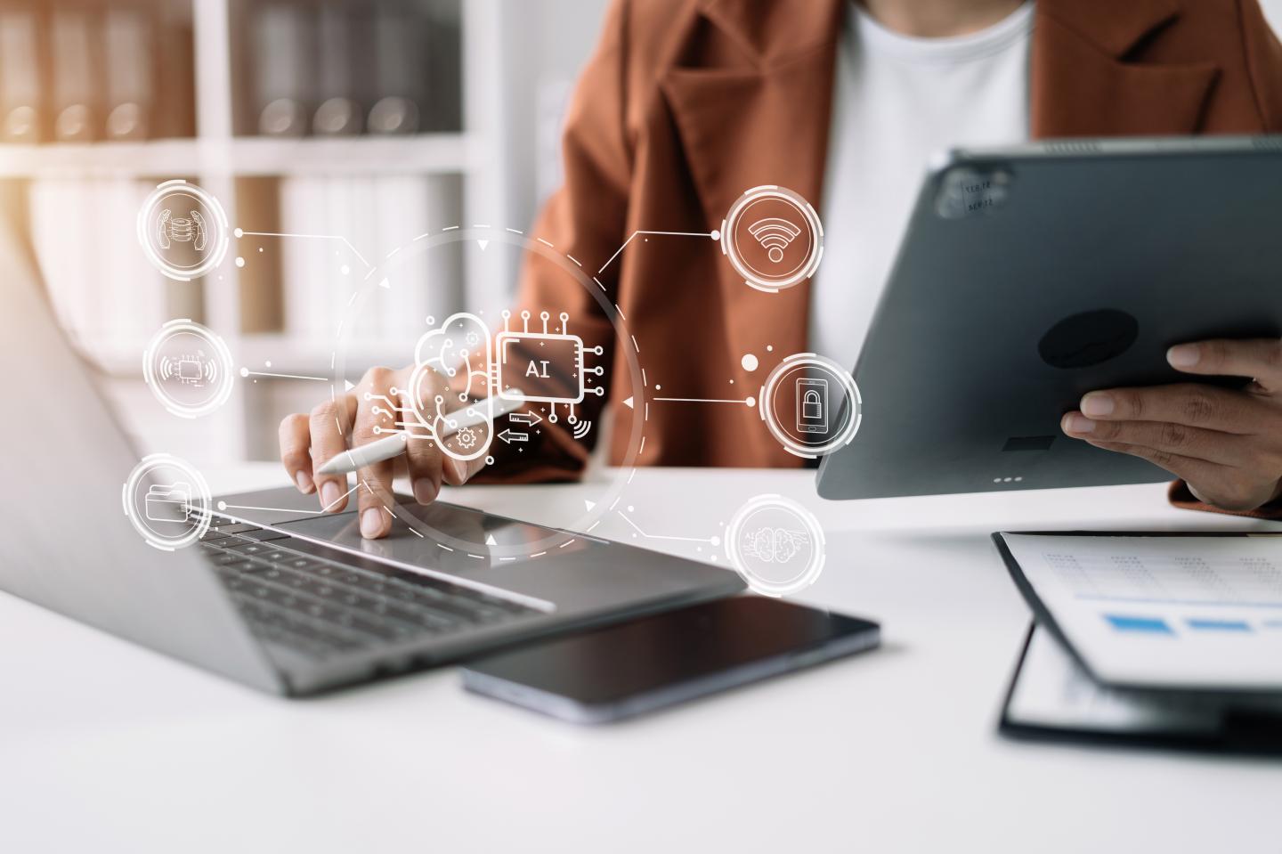 AI or Artificial Intelligence technology. Businessman using a smartphone and laptop computer chatting with an intelligent artificial intelligence. Futuristic technology, automate Chat Bot, Smart Ai.