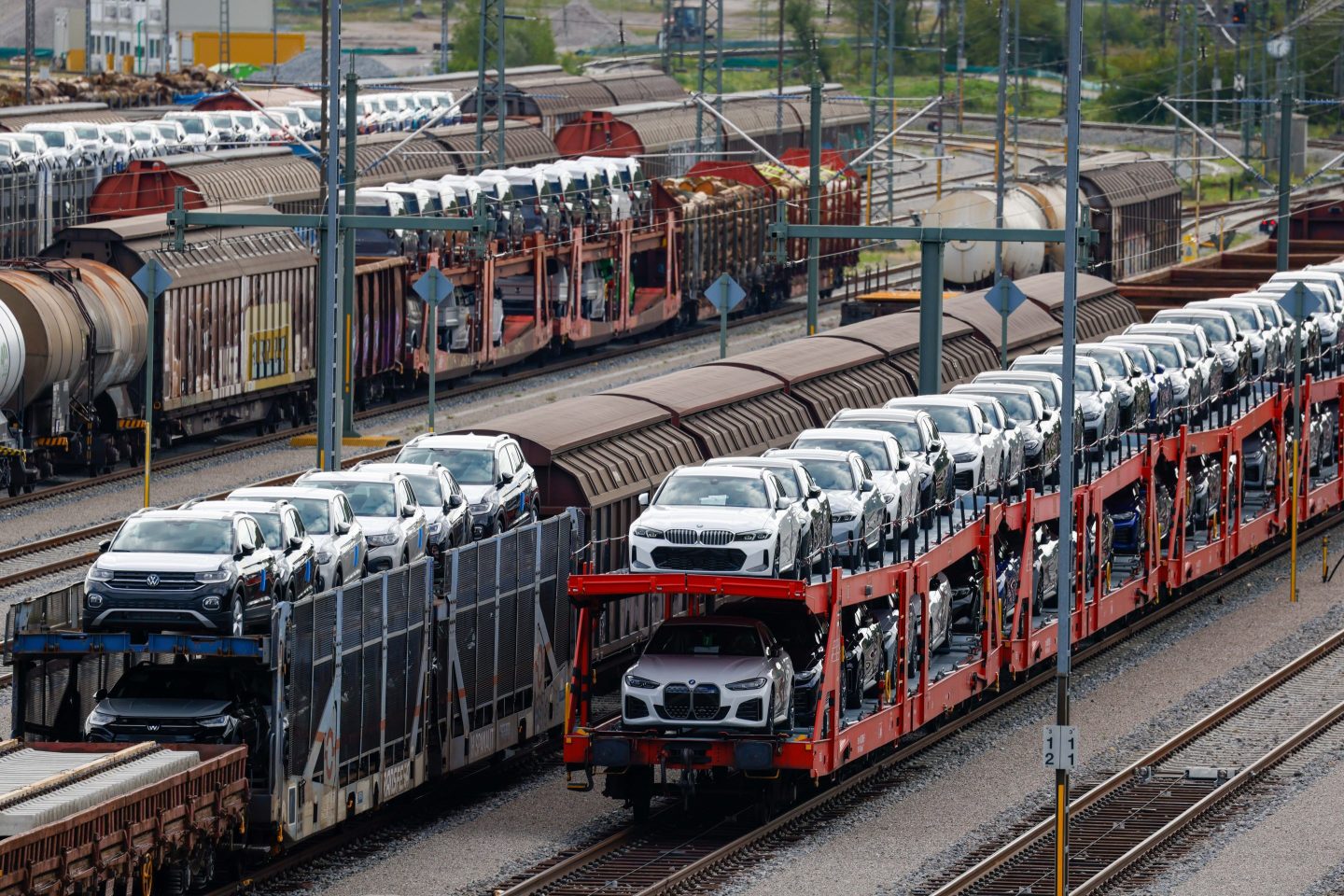 Freight wagons, loaded with newly manufactured Volkswagen AG and BMW AG automobiles, at a railway yard in Munich, Germany, on Friday, July 28, 2023. Germany exited its winter recession in the second quarter but output only stagnated, with questions about the fundamental health of Europe's largest economy remaining.