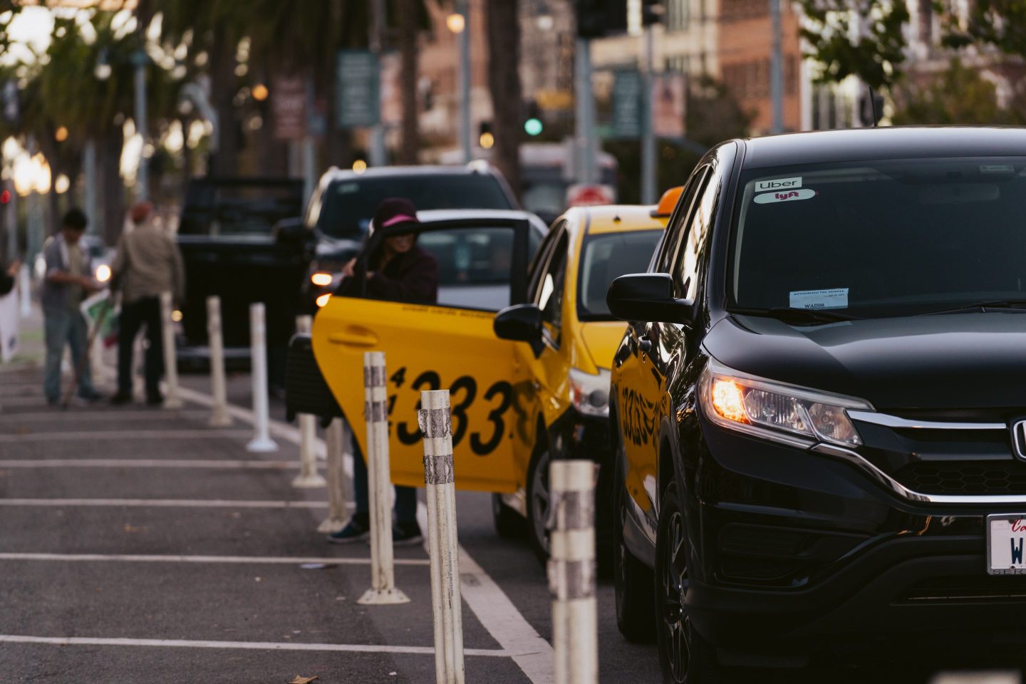 Uber and Lyft signage on a vehicle in San Francisco, California
