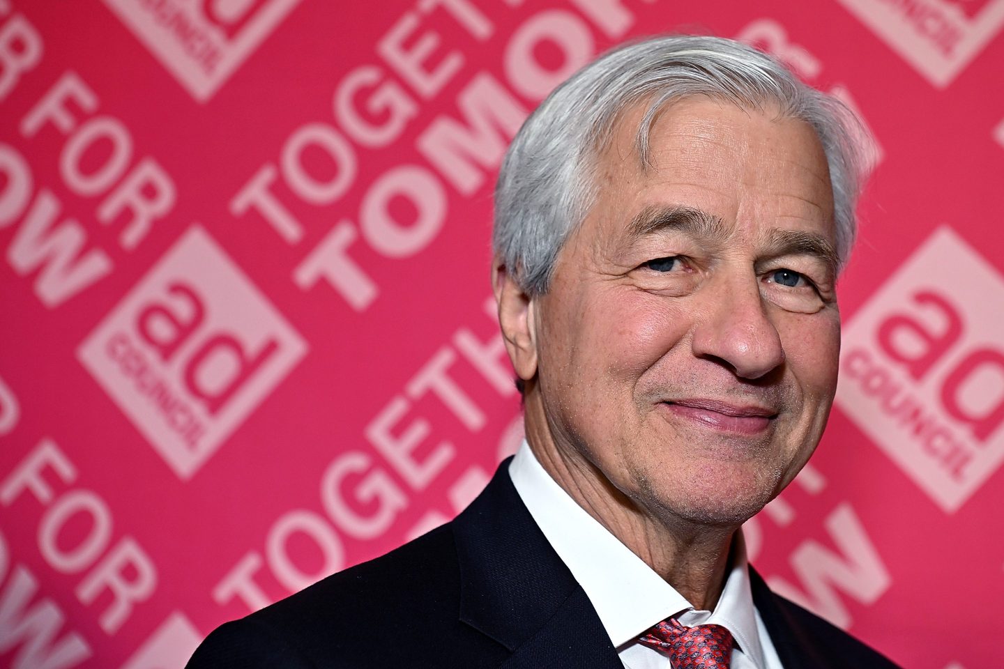 Tight portrait of Jamie Dimon smiling.