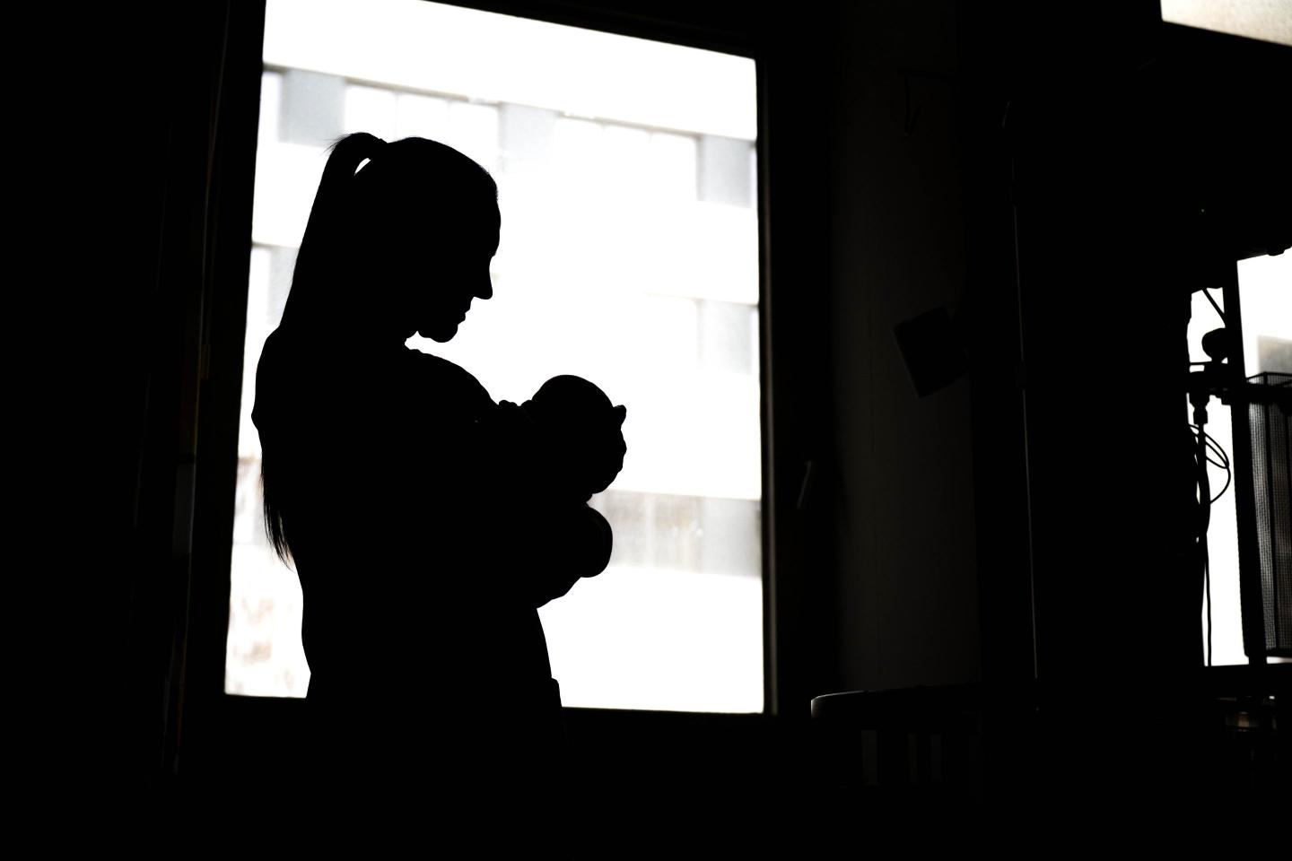woman holding baby