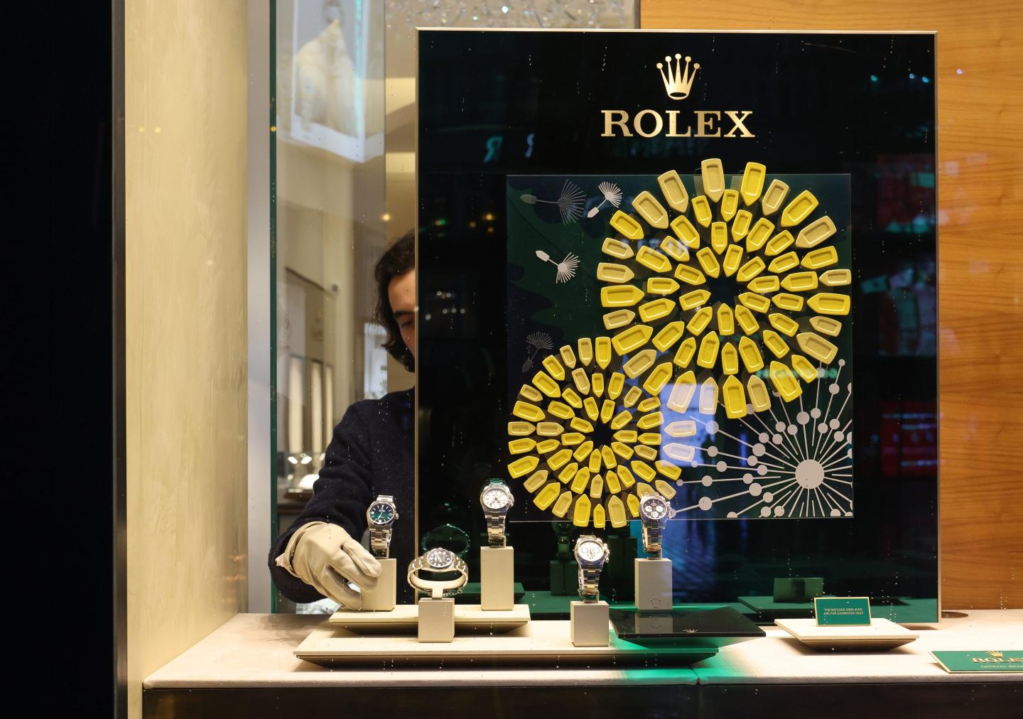 person seen walking outside a rolex store
