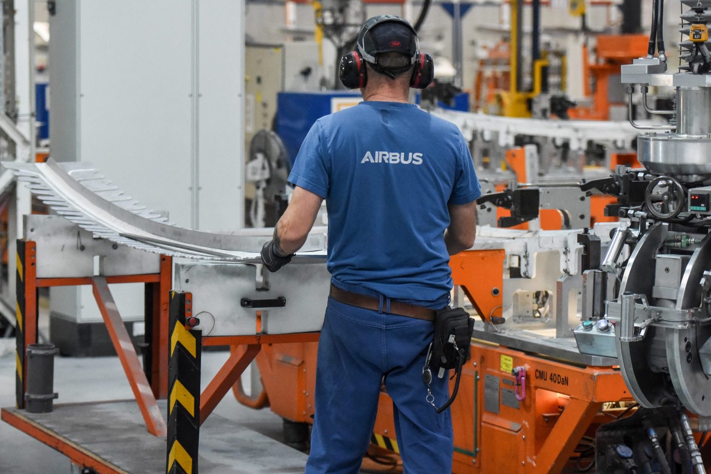 An Airbus employee works on an aircraft part of the Airbus A350 near Nantes, western France, on Feb. 29.