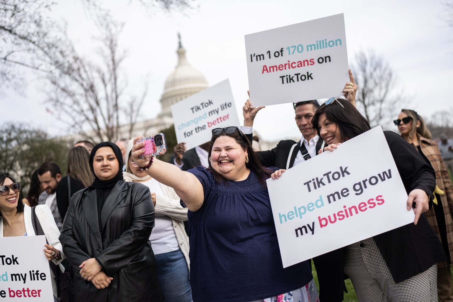 TikTok users campaigning outside Congress.