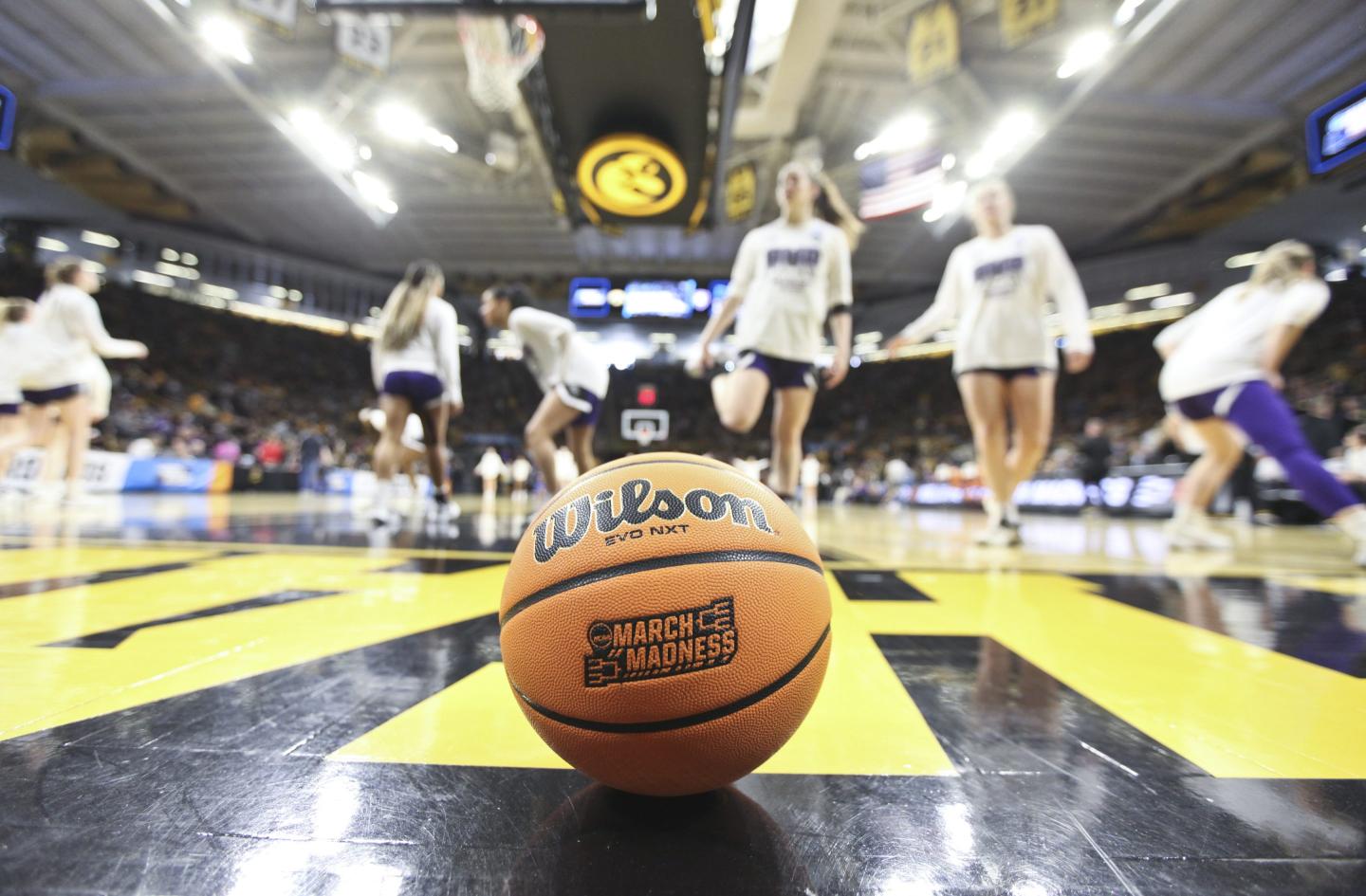 A basketball sitting on the court.