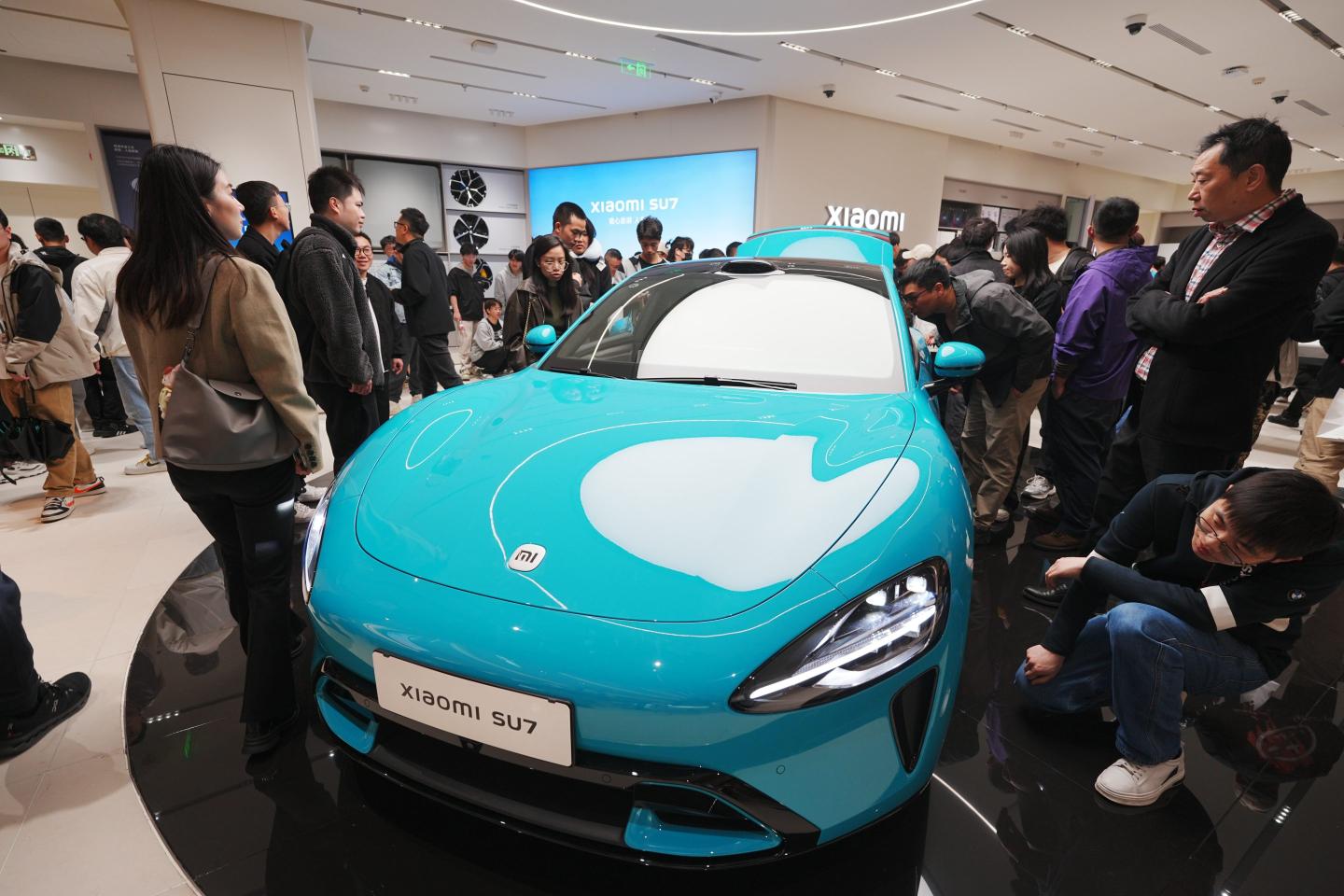 Xiaomi warns potential customers that they may need to wait over half a year to get the company’s new EV, as its shares jump by as much as 16%