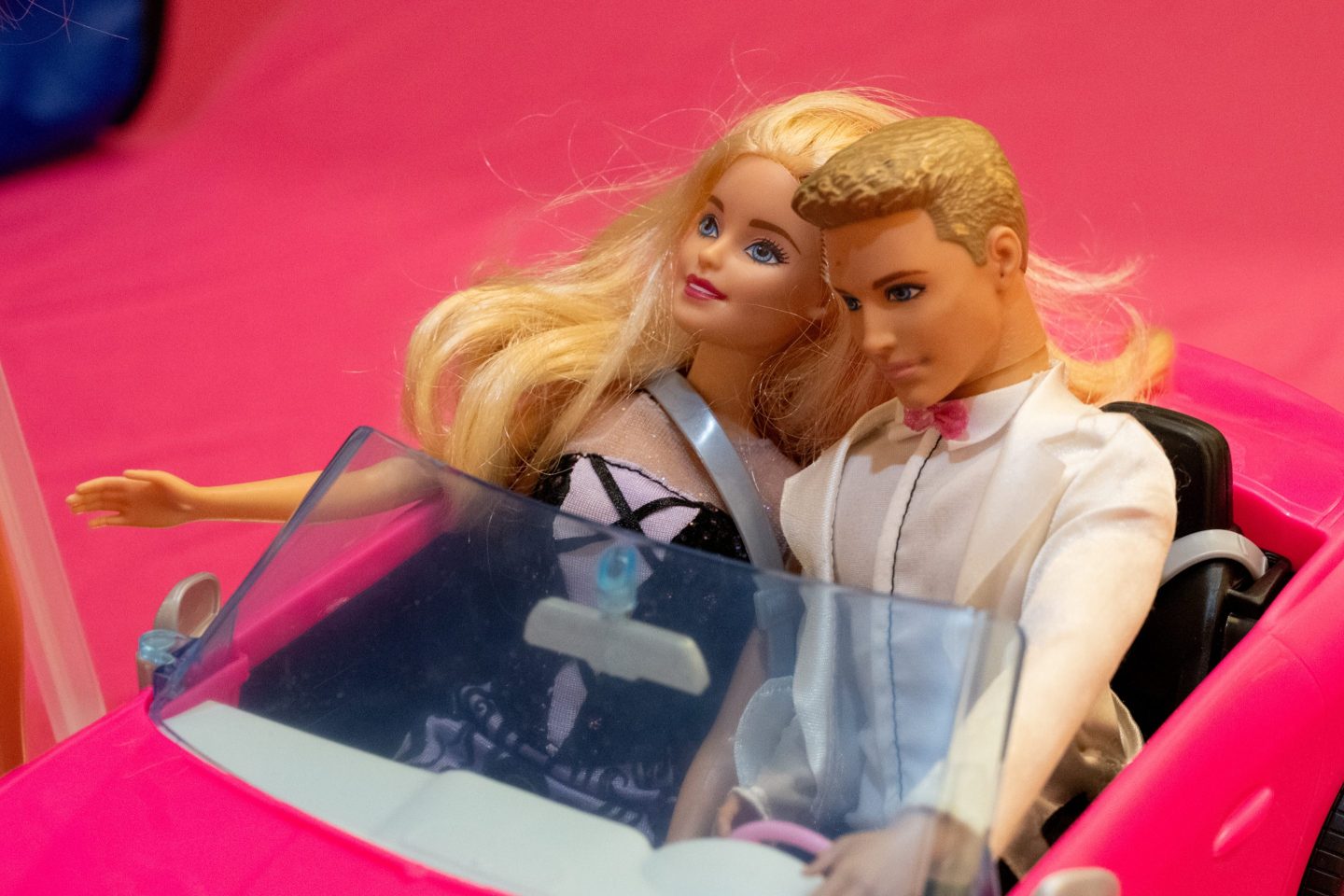 Barbie and Ken figurines in a Barbie pink vehicle, Lafayette, California.