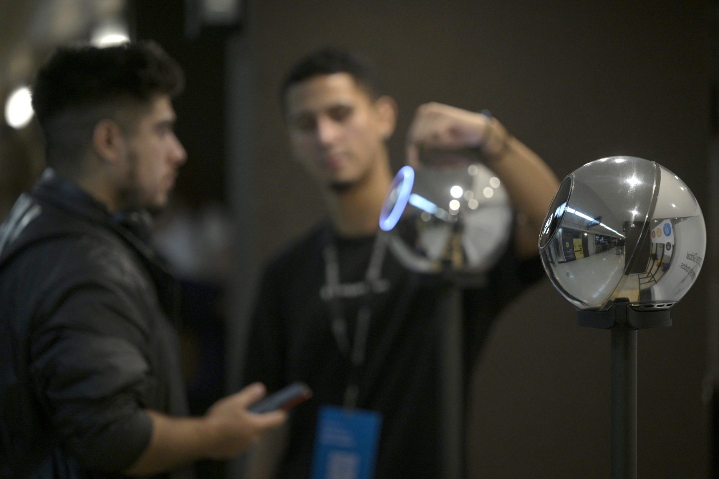 A man has his iris scanned with a biometric data scanning device in exchange for Worldcoin cryptocurrency in Buenos Aires on March 22, 2024.