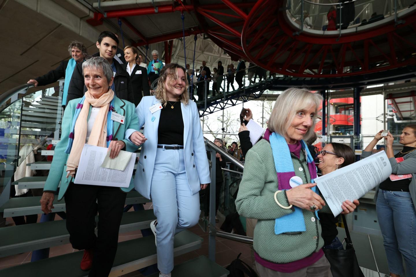 Members of the Swiss association Senior Women for Climate Protection react after the announcement of decisions after a hearing of the European Court of Human Rights.
