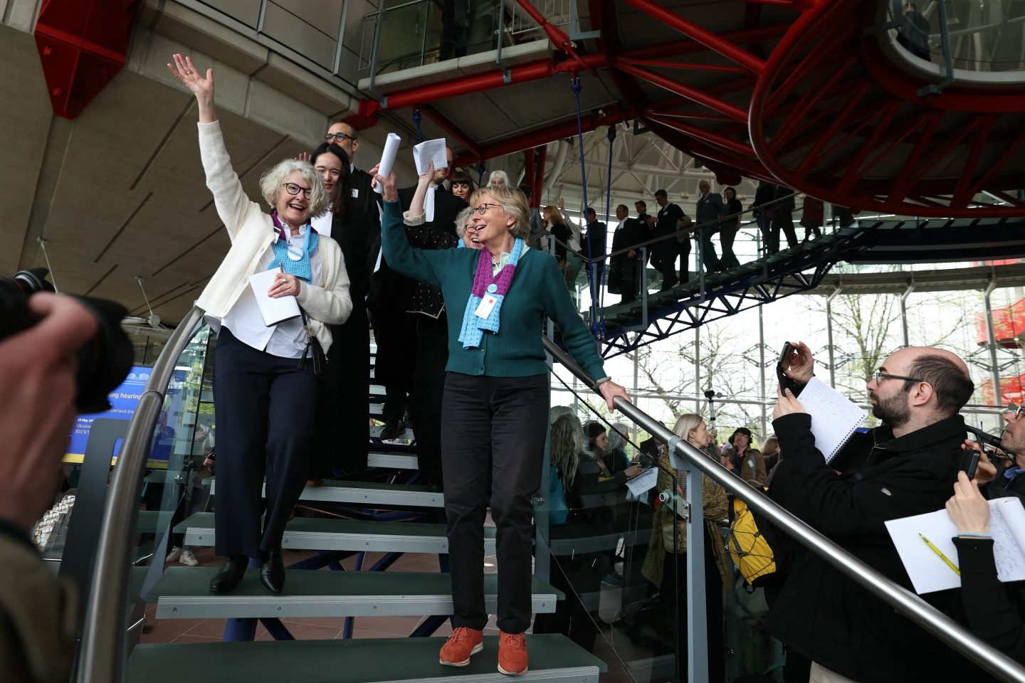 Members of Swiss association Senior Women for Climate Protection react after the European Court of Human Rights ruled in their favor in a climate case they filed against Switzerland on April 9, 2024 in France.