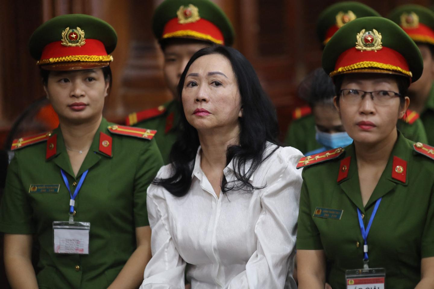 Vietnamese property tycoon Truong My Lan, in the center, looks on at a court in Ho Chi Minh city on April 11, 2024.