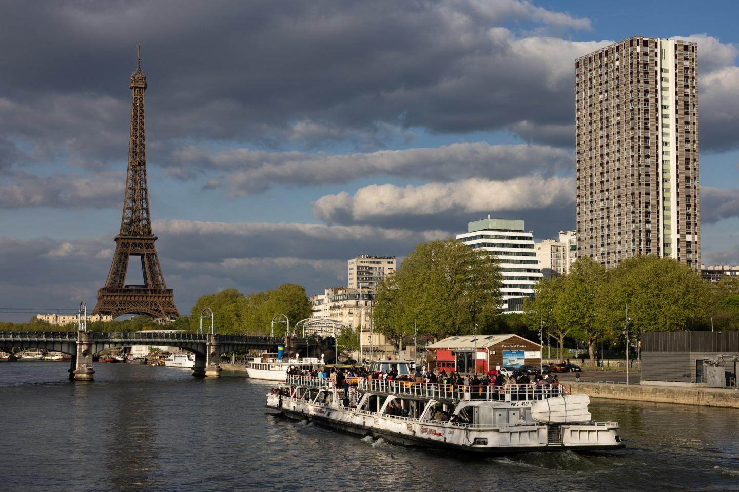 Eiffel Tower stands above Seine river