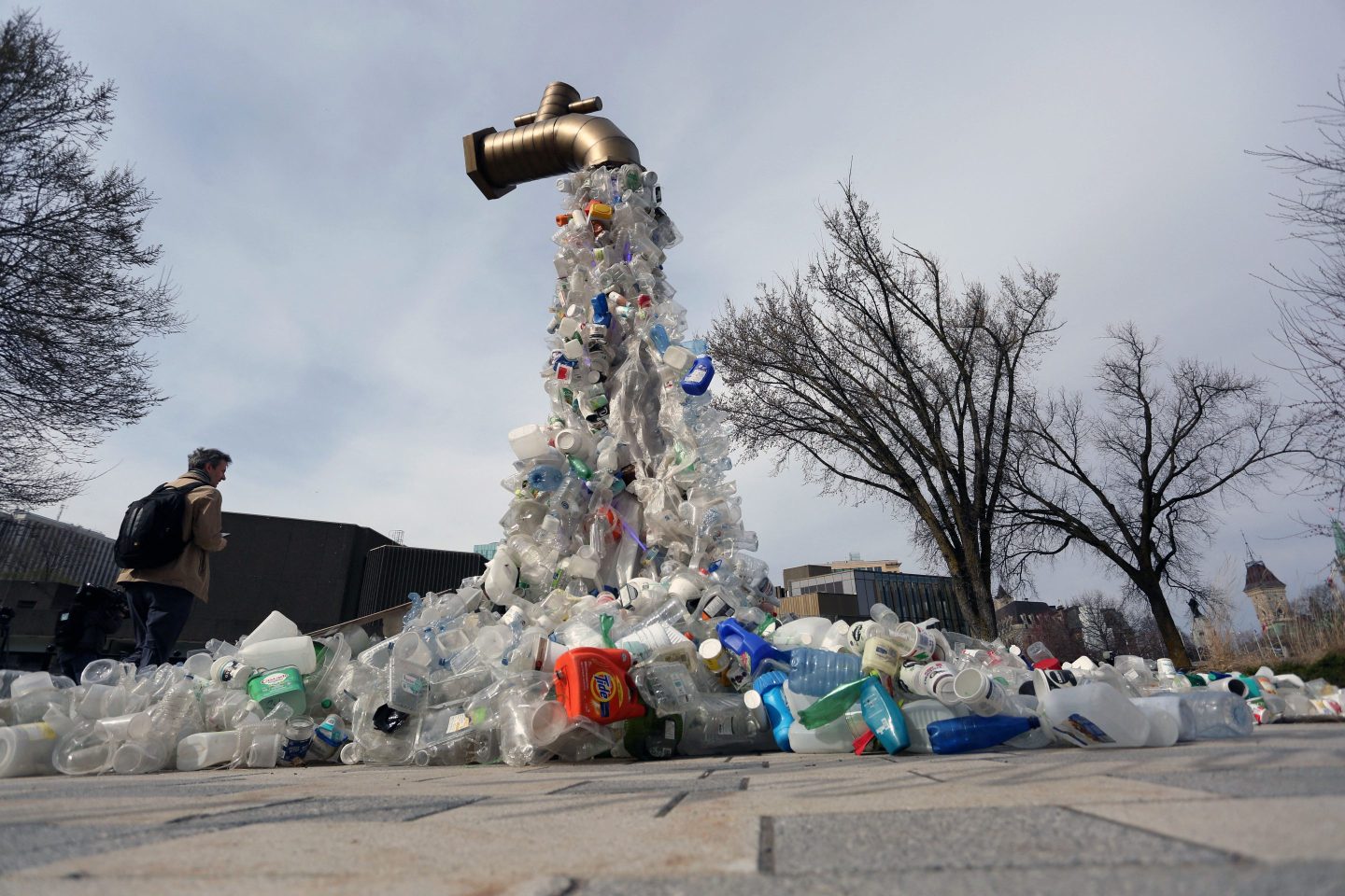A sculpture titled "Giant Plastic Tap" by Canadian artist Benjamin Von Wong is displayed outside the UN Intergovernmental Negotiating Committee on Plastic Pollution in Ottawa on April 23, 2024.