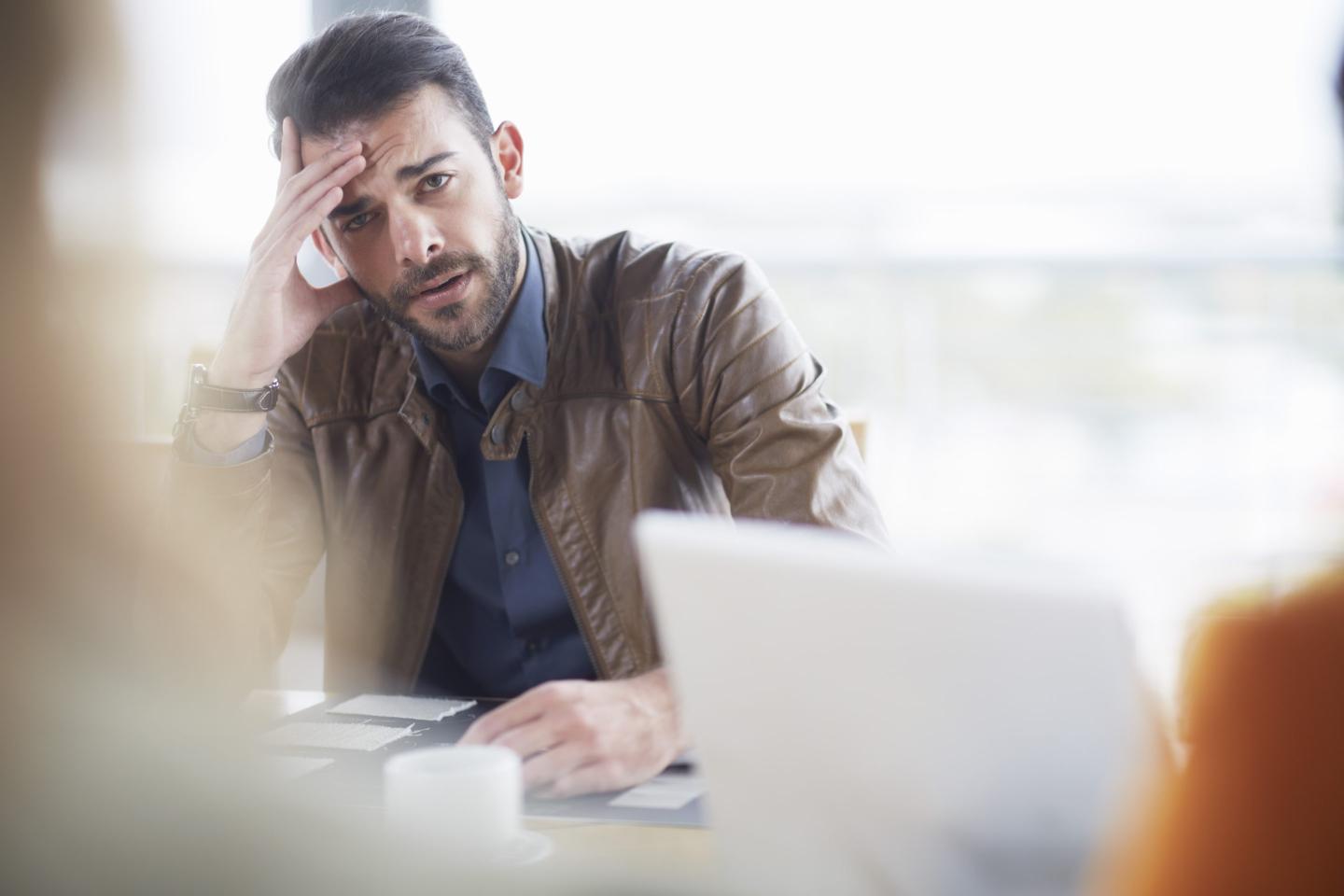 Portrait of doubting businessman