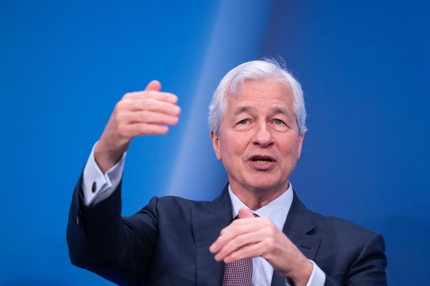 Jamie Dimon gestures on stage