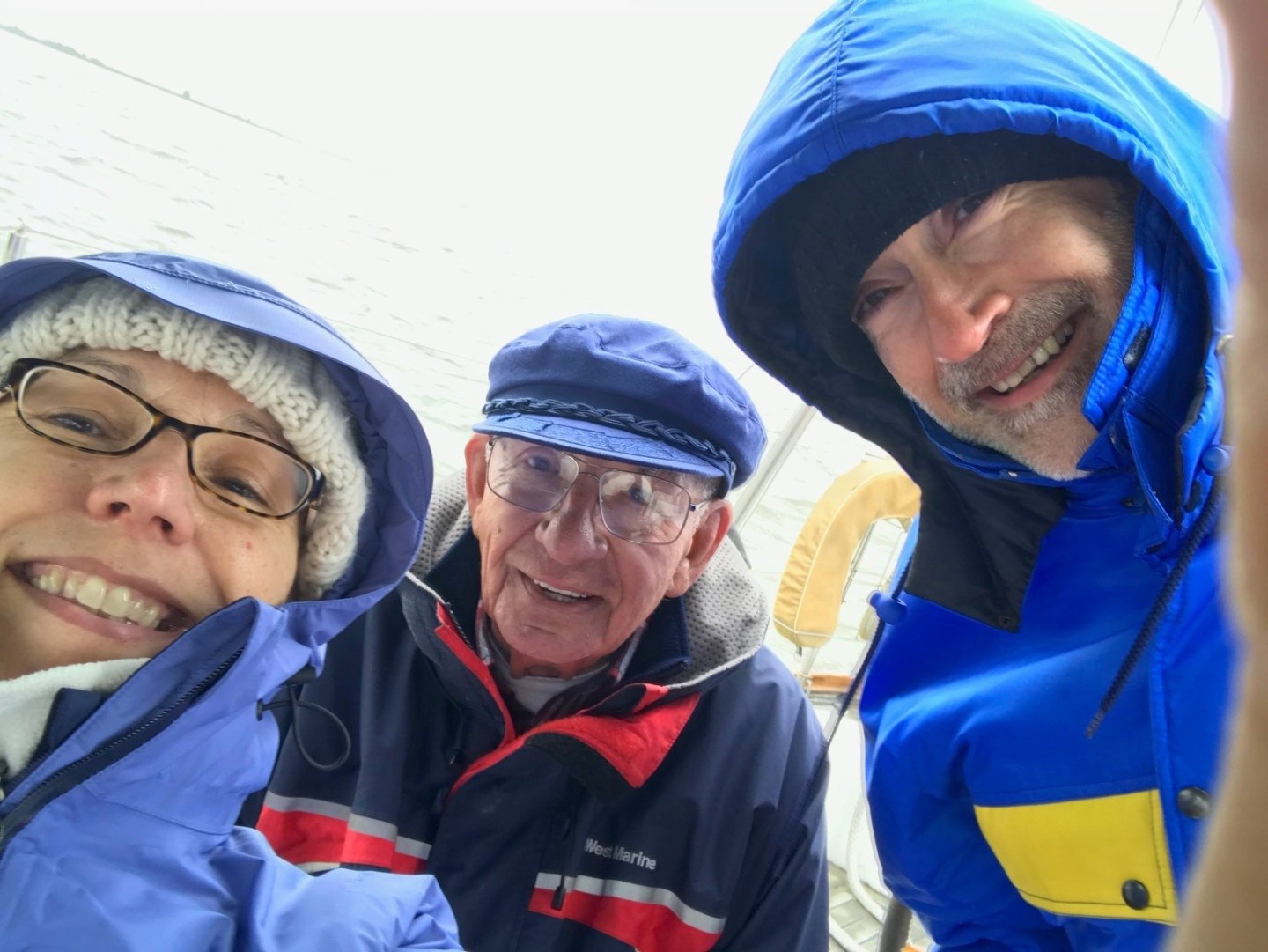 Renee Stanton, Bill Emenecker, Trey Slough are pictured sailing.