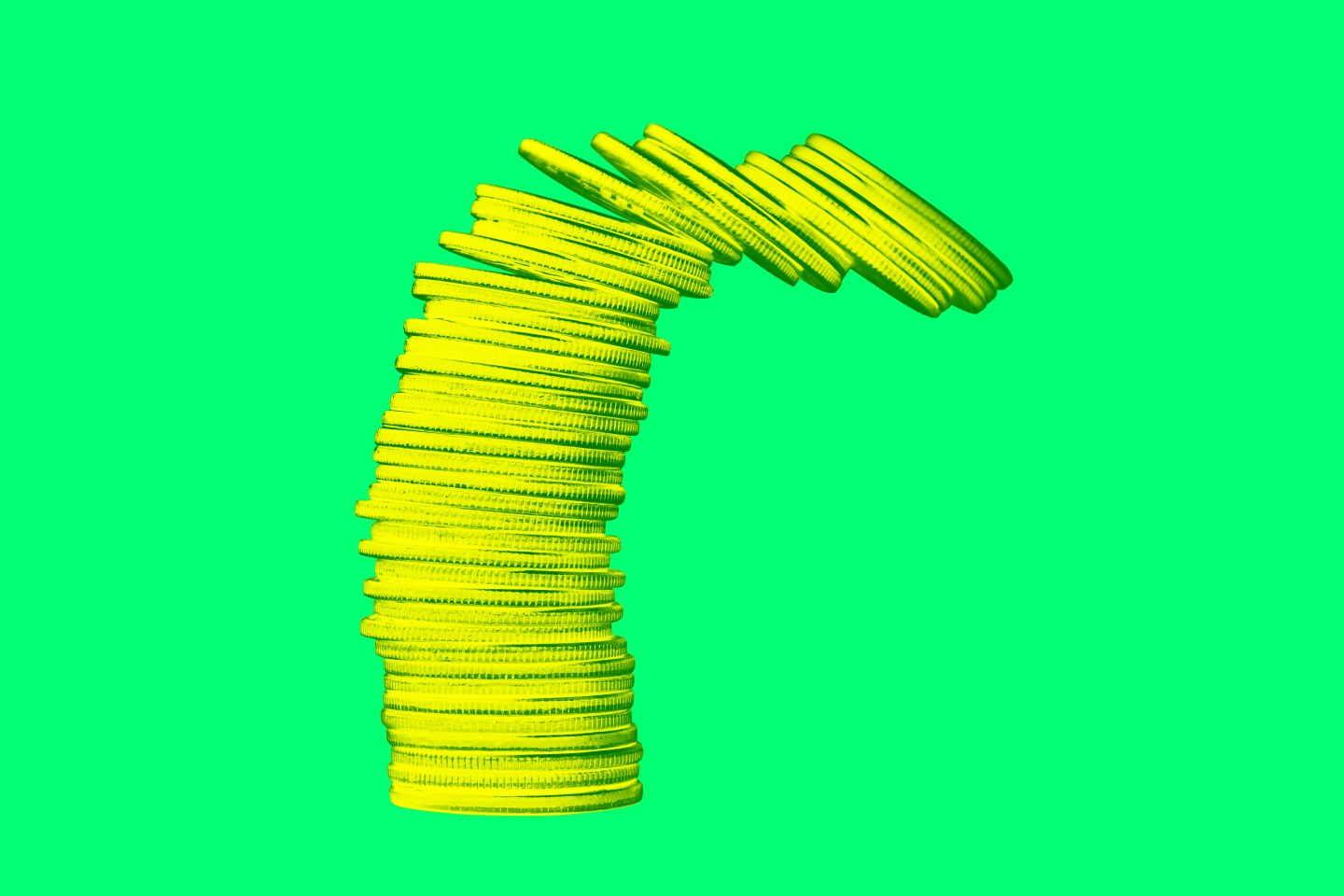 A pile of gold coins tipping over