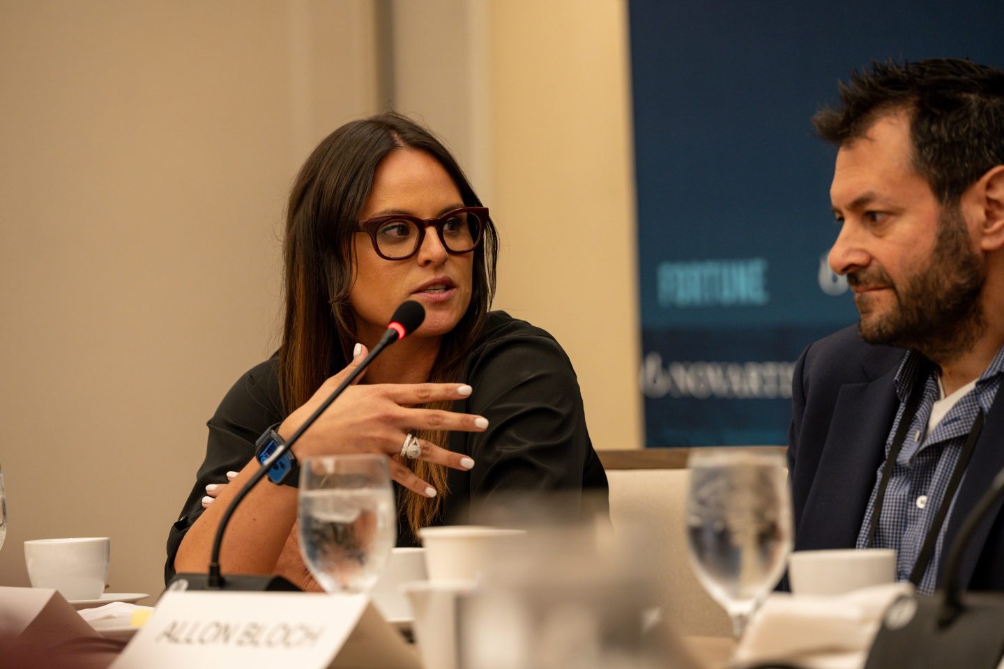 Liana Douillet Guzmán, Chief Executive Officer, FOLX Health, speaking at a microphone