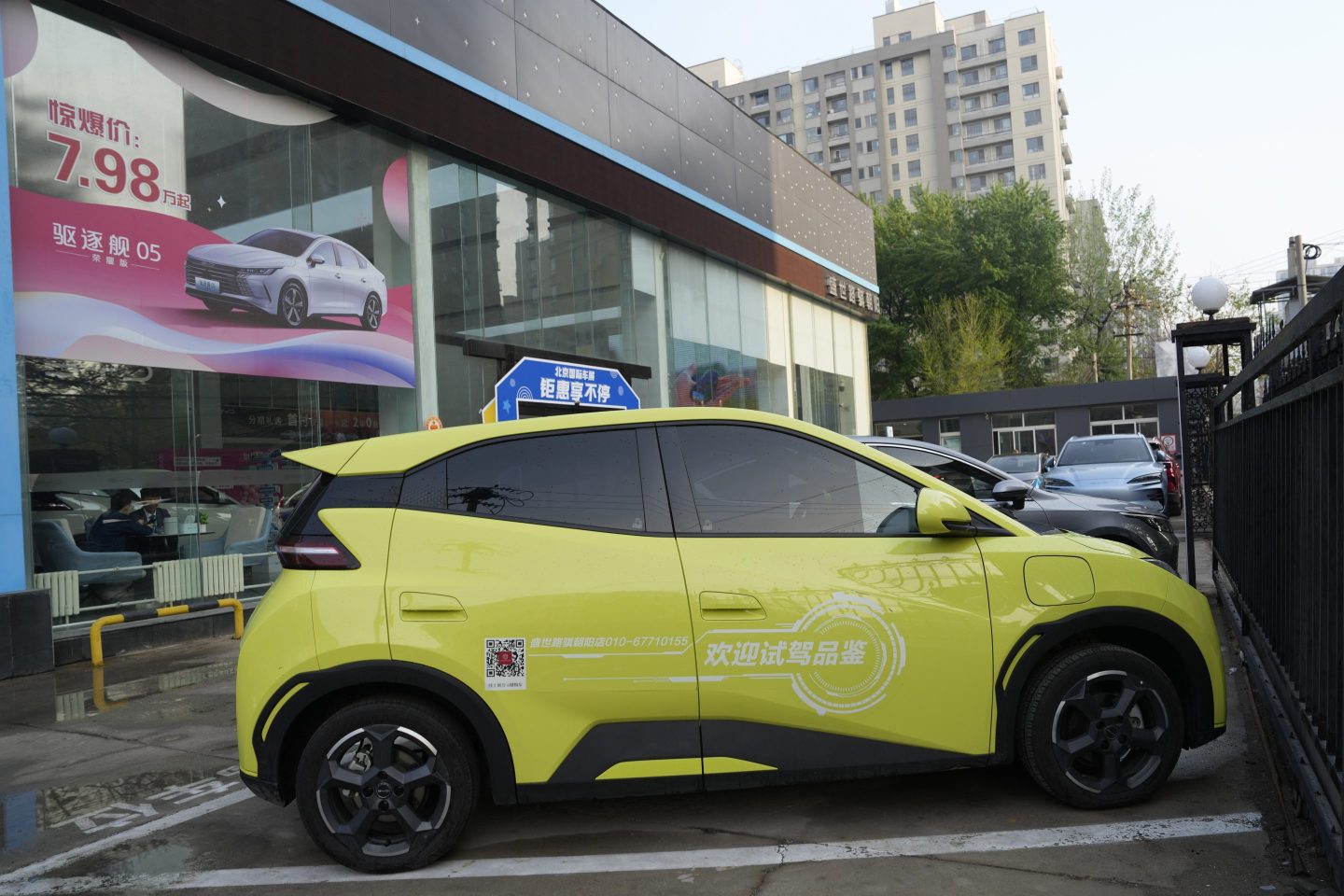 A Seagull electric vehicle from Chinese automaker BYD for test driving is parked outside a showroom in Beijing, on April 10, 2024.