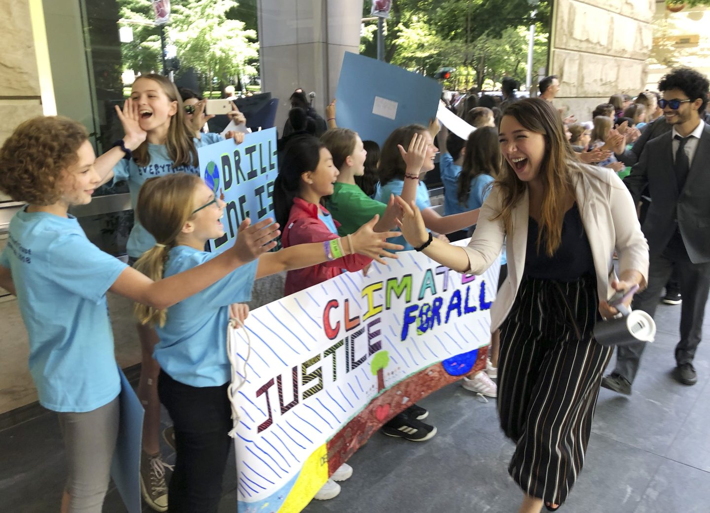 Kelsey Juliana, of Eugene, Ore., a lead plaintiff who is part of a lawsuit by a group of young people who say U.S. energy policies are causing climate change and hurting their future, greets supporters outside a federal courthouse, June 4, 2019, in Portland, Ore. A 9th U.S. Circuit Court of Appeals panel on Wednesday, May 1, 2024, rejected a long-running lawsuit brought by young Oregon-based climate activists who argued that the U.S. government's role in climate change violated their constitutional rights.