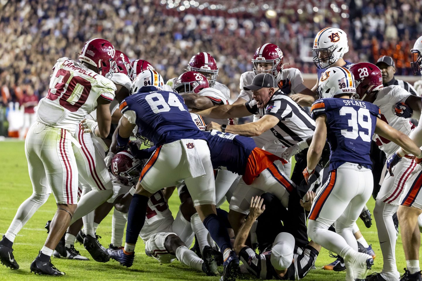 Referees break up altercation between college football players