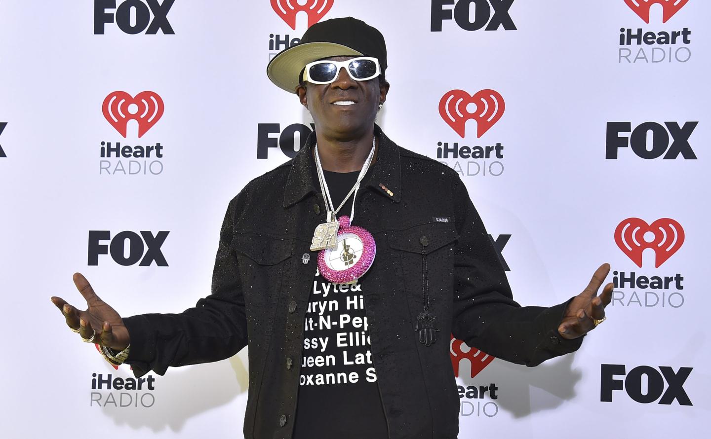 Flavor Flav poses for pictures
