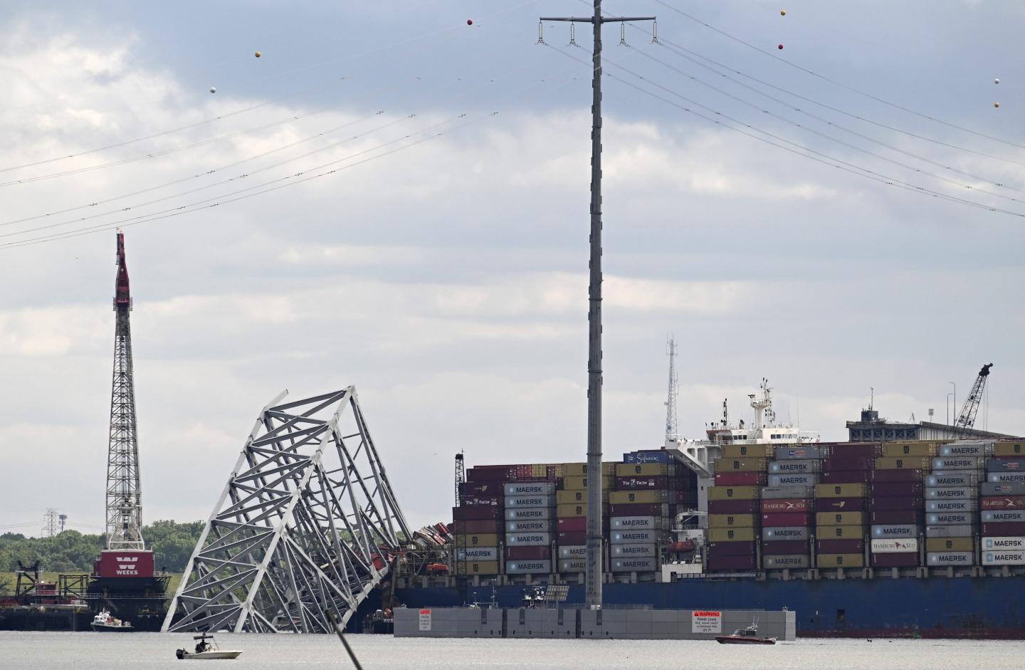collapsed bridge and cargo ship