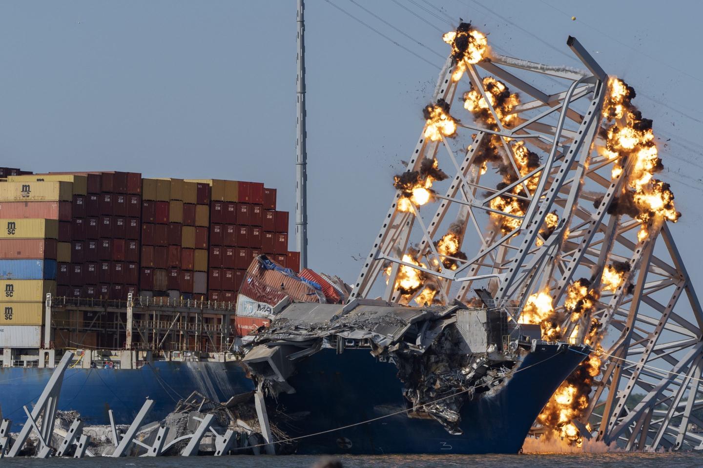 Controlled explosions light up collapsed Francis Scott Key Bridge on Monday.
