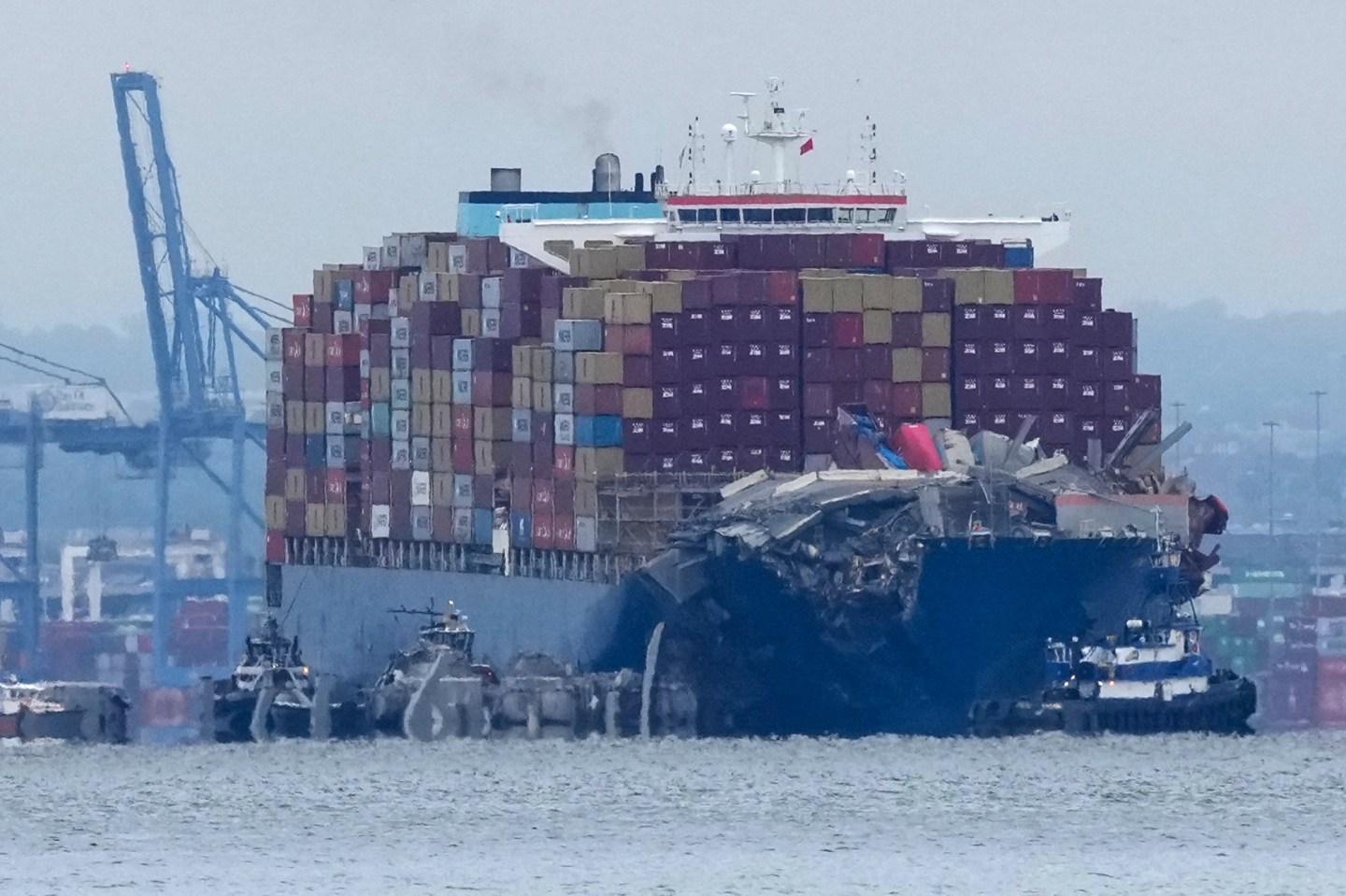 Crews work to move the cargo ship Dali in Baltimore, Monday, May 20, 2024. The vessel on March 26 struck the Francis Scott Key Bridge causing it to collapse and resulting in the death of six people. (AP Photo/Matt Rourke)