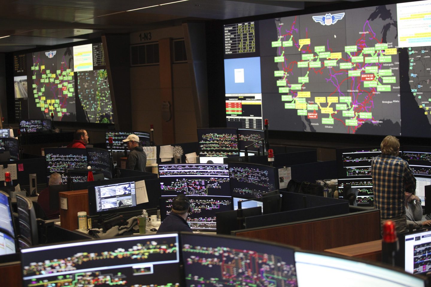 Union Pacific dispatchers keep track of trains moving across the western United States from inside the railroad's high-tech Harriman Dispatch Center, in Omaha, Neb. on Dec. 15, 2023.