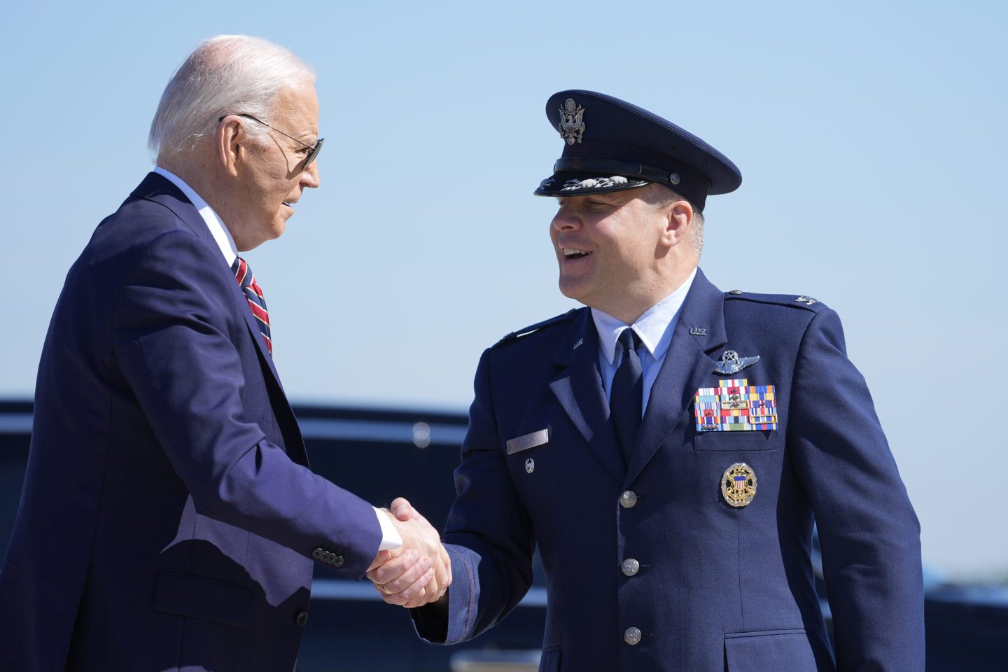 President Joe Biden is greeted by Col. Paul Pawluk, Vice Commander of the 89th Airlift Wing, as he arrives on Air Force One, on May 21, 2024, at Andrews Air Force Base, Md.