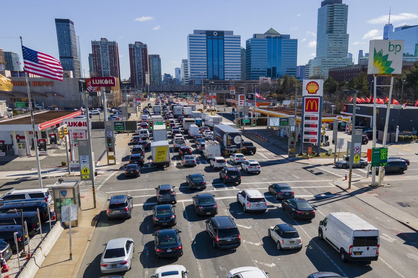 Commuters wait to drive through the Holland Tunnel into New York City during morning rush hour traffic in Jersey City, N.J.,, on March 8, 2023.