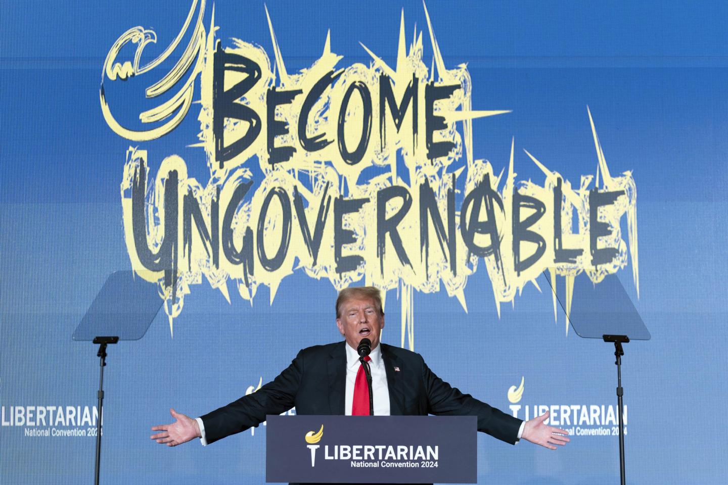 Donald Trump speaks at podium