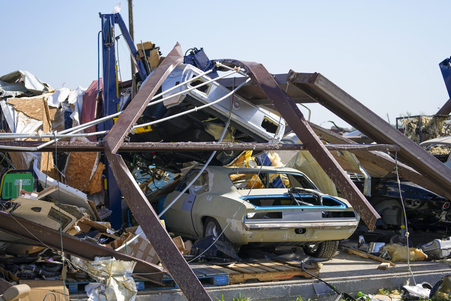 destroyed cars are stacked on top of each other