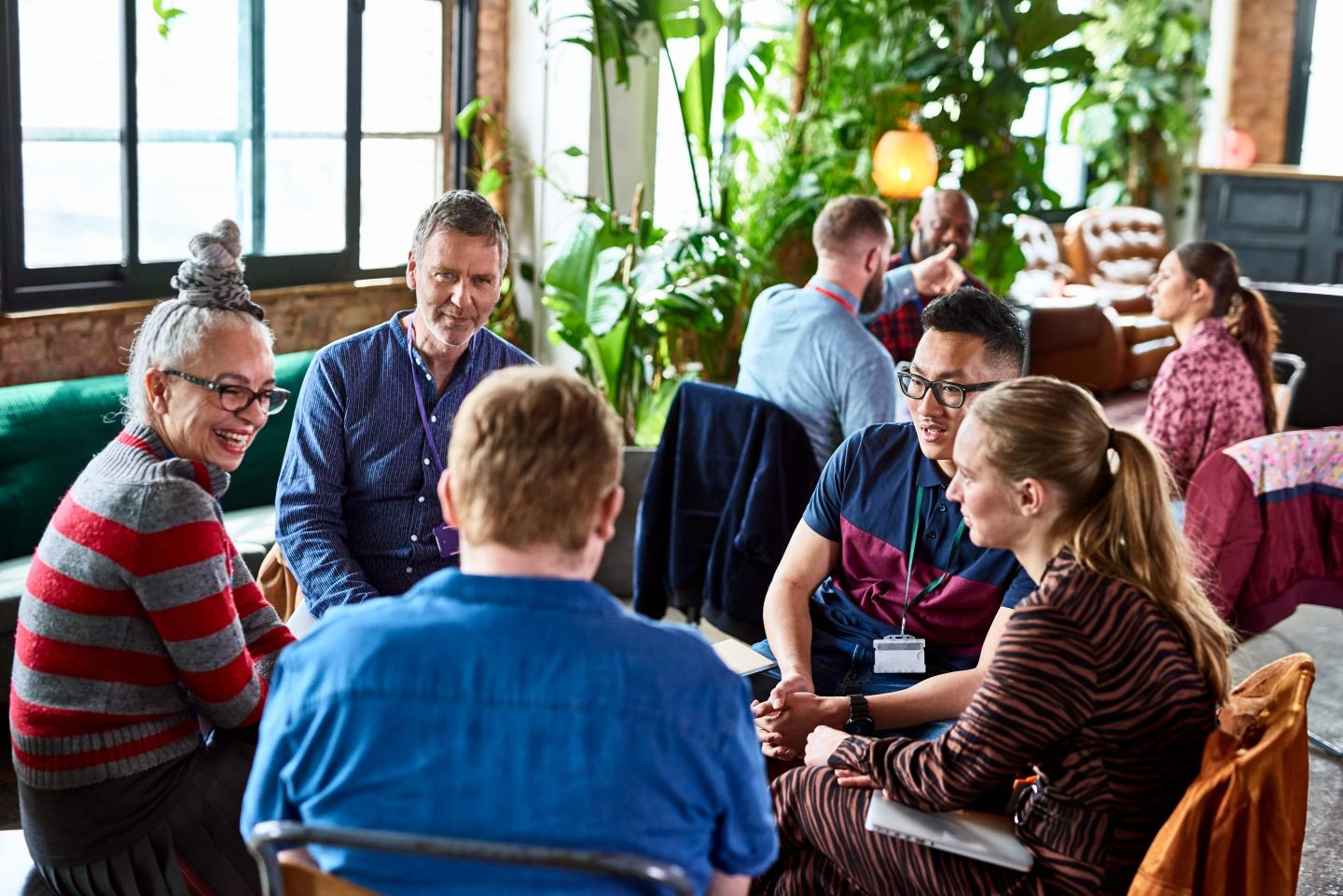 colleagues meeting in open office space