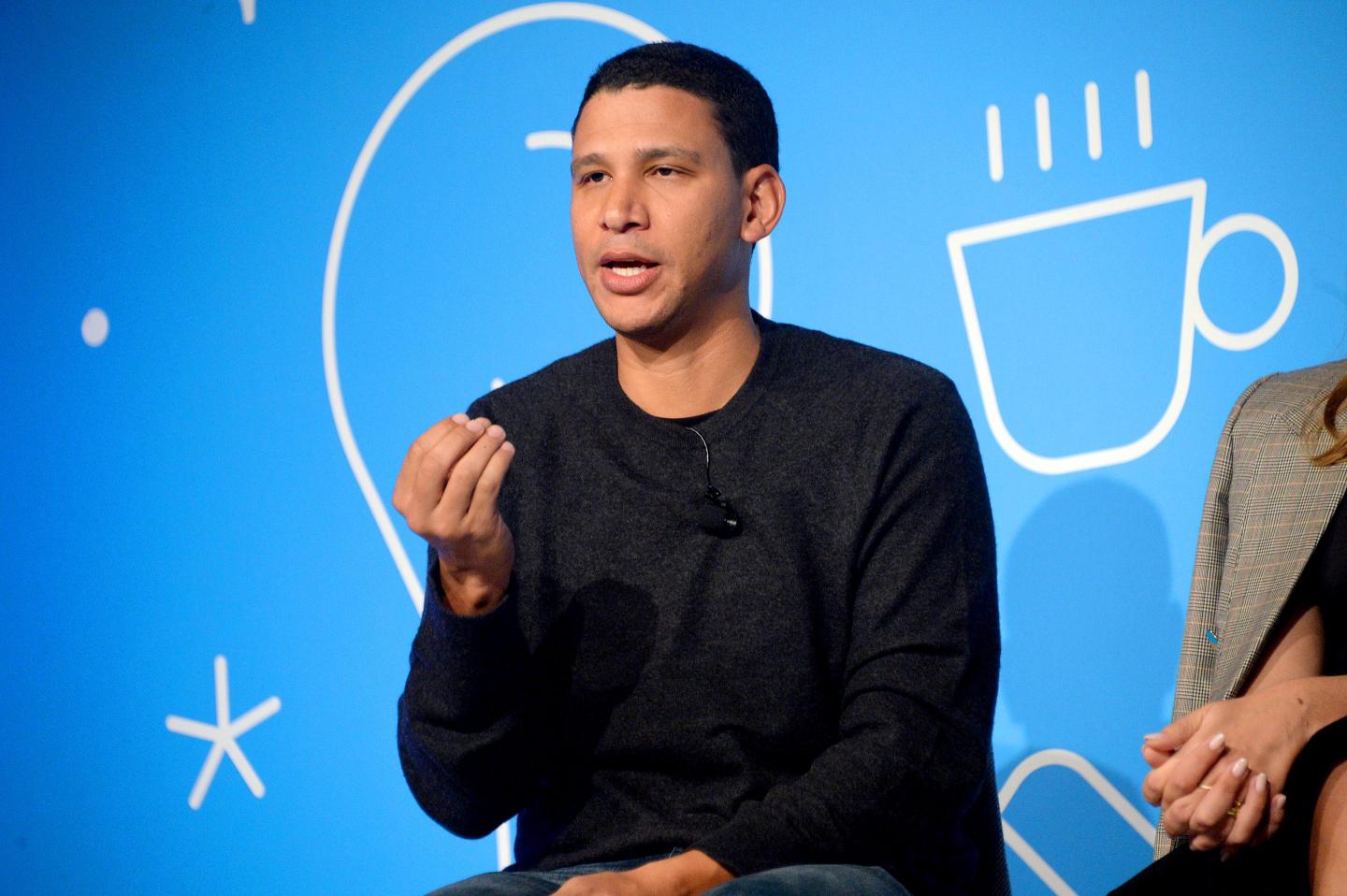 Robert Reffkin gestures with hand while speaking