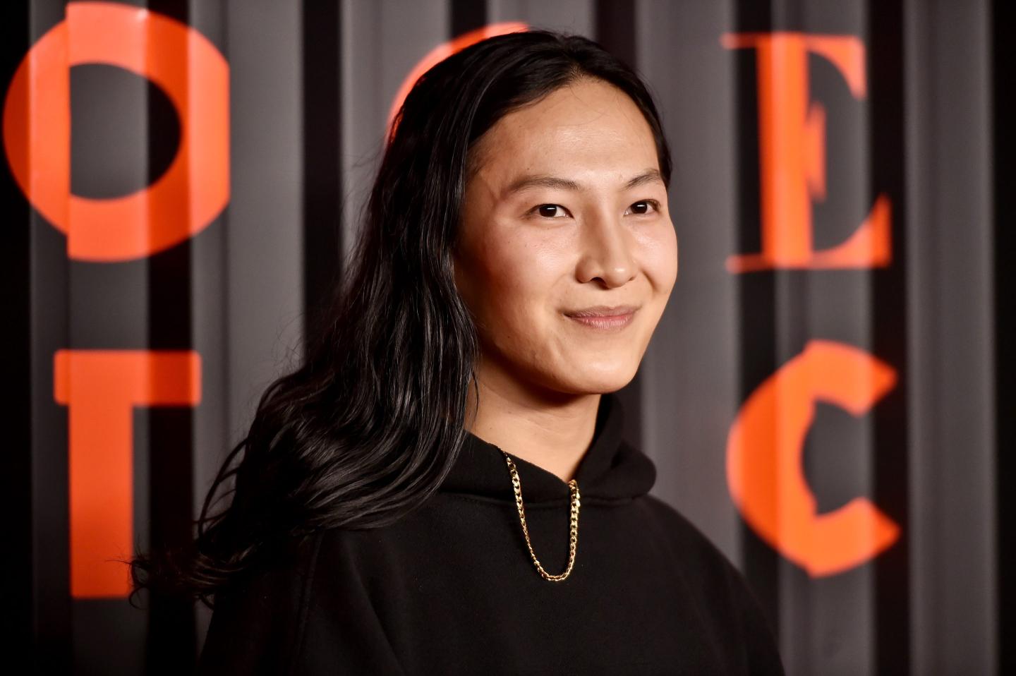 Designer Alexander Wang smiles at an event